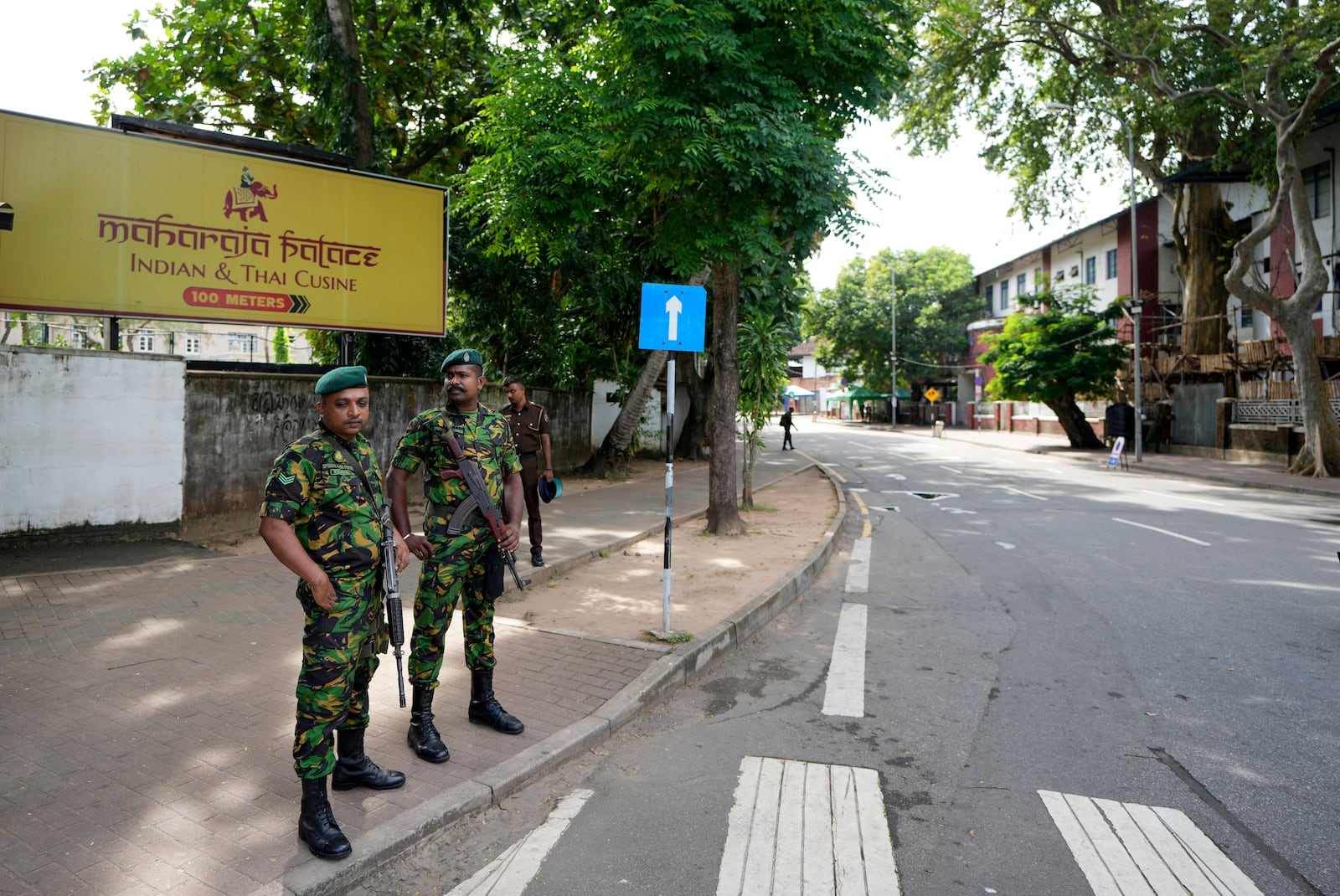 Police commandos stand guard, as a countrywide curfew was imposed then, outside a ballot counting center during the presidential election in Colombo, Sri Lanka, Sunday, Sept. 22, 2024. (AP Photo/Rajesh Kumar Singh)