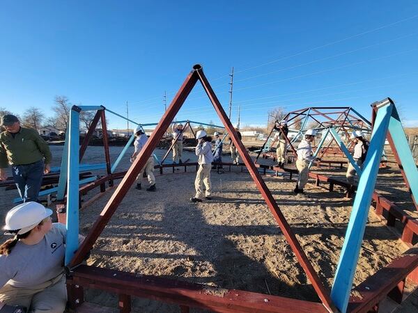 An AmeriCorps team works on a greenhouse in Casper, Wyoming, in 2024 for the Casper Housing Authority, a nonprofit organization that relies on the now-suspended program. (AP via Jamie Purcell)