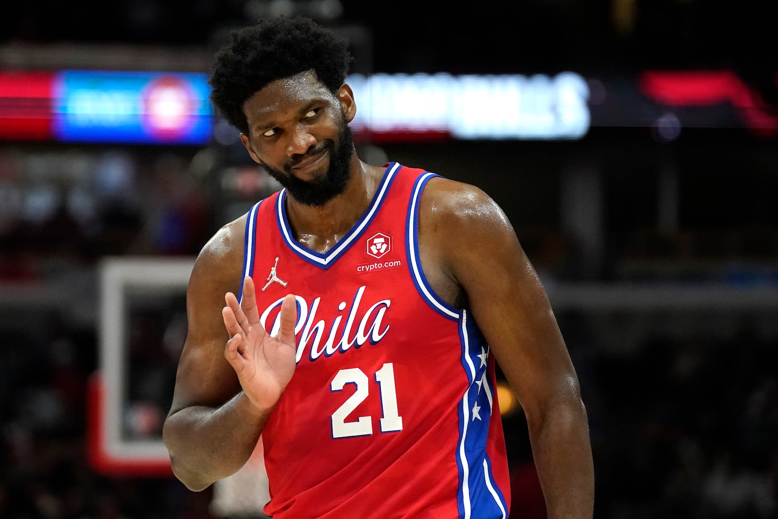 FILE - Philadelphia 76ers' Joel Embiid waves to Chicago Bulls fans after hitting a 3-point shot late in the second half of the team's NBA basketball game against the Bulls of Saturday, Nov. 6, 2021, in Chicago. (AP Photo/Charles Rex Arbogast, File)