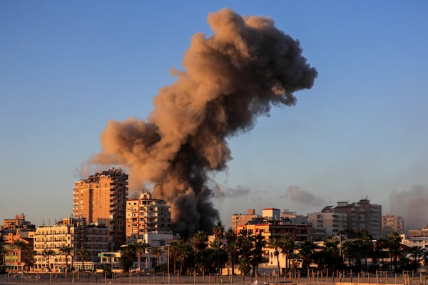 Smoke rises from a building hit in an Israeli airstrike in Tyre, southern Lebanon, Saturday, Nov. 16, 2024. (AP Photo/Mohammed Zaatari)