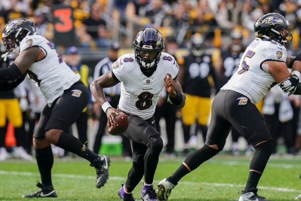 Baltimore Ravens quarterback Lamar Jackson scrambles against the Pittsburgh Steelers during the first half of an NFL football game, Sunday, Nov. 17, 2024, in Pittsburgh. (AP Photo/Matt Freed)