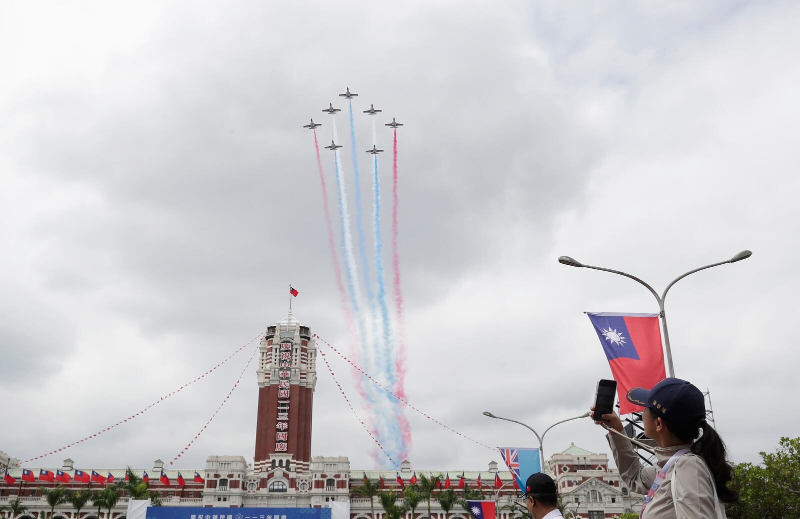 Thunder Tiger Aerobatics Team aircraft fly over the President Office during National Day celebrations in front of the Presidential Building in Taipei, Taiwan, Thursday, Oct. 10, 2024. (AP Photo/Chiang Ying-ying)