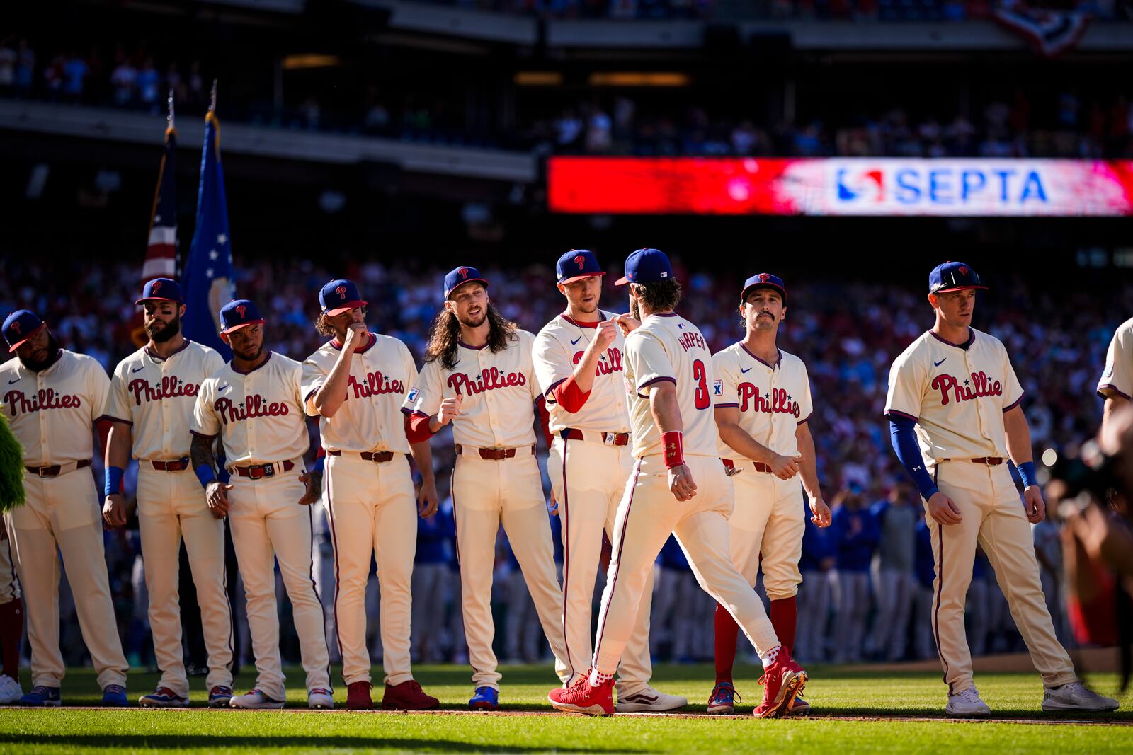 Philadelphia Phillies' Bryce Harper (3) greets teammates after he was announced ahead of Game 1 of a baseball NL Division Series against the New York Mets, Saturday, Oct. 5, 2024, in Philadelphia. (AP Photo/Matt Slocum)