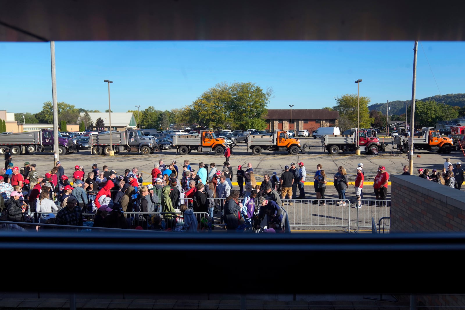 Supporters wait for Republican presidential nominee former President Donald Trump to arrive at a rally, Saturday, Sept. 28, 2024, in Prairie du Chien, Wis. (AP Photo/Charlie Neibergall)