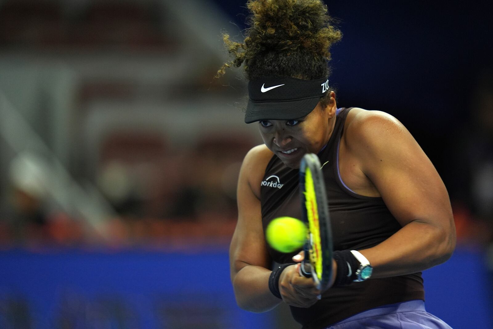 Naomi Osaka of Japan returns a shot from Coco Gauff of the United States in a women's singles match for the China Open tennis tournament held at the National Tennis Center in Beijing, Tuesday, Oct. 1, 2024. (AP Photo/Ng Han Guan)