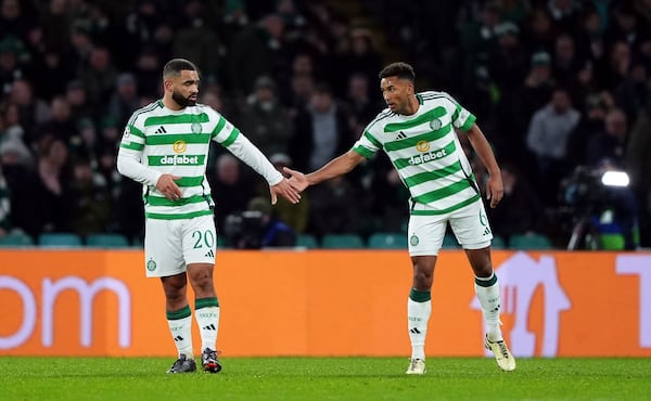 Celtic's Cameron Carter-Vickers, left, after scoring an own goal for Club Brugge during the UEFA Champions League opening phase soccer stage match at Celtic Park, Glasgow, Scotland, Wednesday Nov. 27, 2024. (Andrew Milligan/PA via AP)