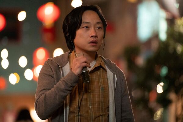 This image released by Hulu shows Jimmy O. Yang in a scene from the series "Interior Chinatown." (Mike Taing/Hulu via AP)