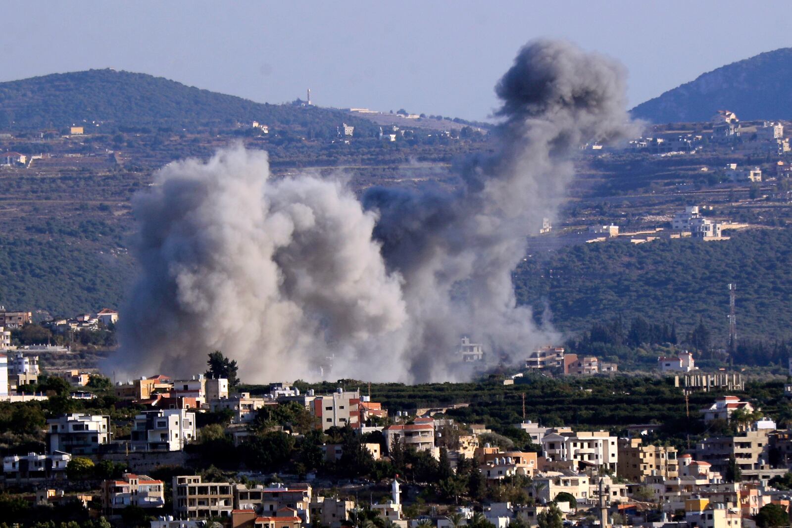 Smoke rises from an Israeli airstrike on Majdal Zoun village, in this view from the southern city of Tyre, south Lebanon, Thursday, Oct. 24, 2024. (AP Photo/Mohammed Zaatari)