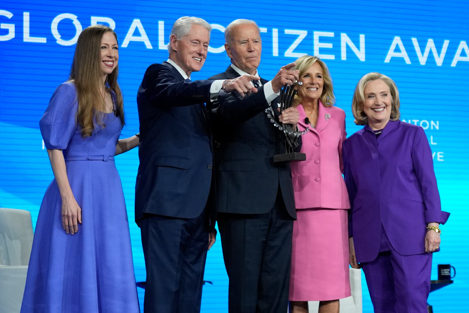 President Joe Biden is presented with the Global Citizen Award by Chelsea Clinton, former President Bill Clinton, first lady Jill Biden and former Secretary of State Hillary Clinton at the Clinton Global Initiative Monday, Sept. 23, 2024, in New York. (AP Photo/Manuel Balce Ceneta)