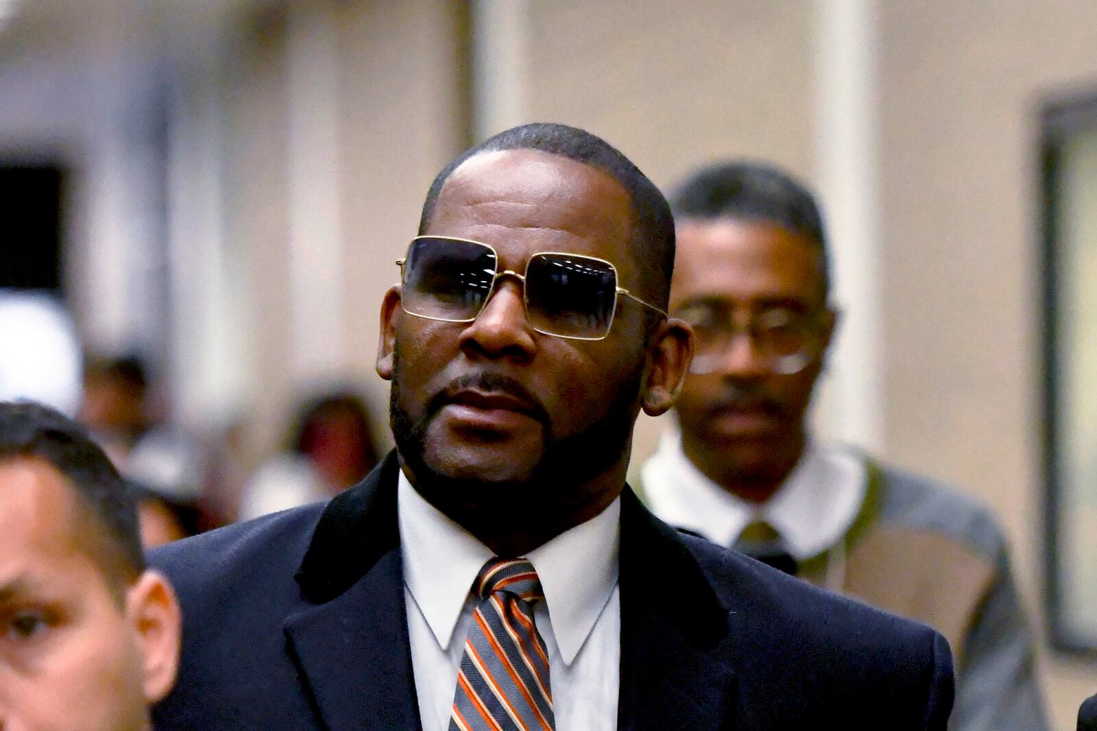 FILE - R. Kelly leaves the Daley Center after a hearing in his child support case, May 8, 2019, in Chicago. (AP Photo/Matt Marton, File)