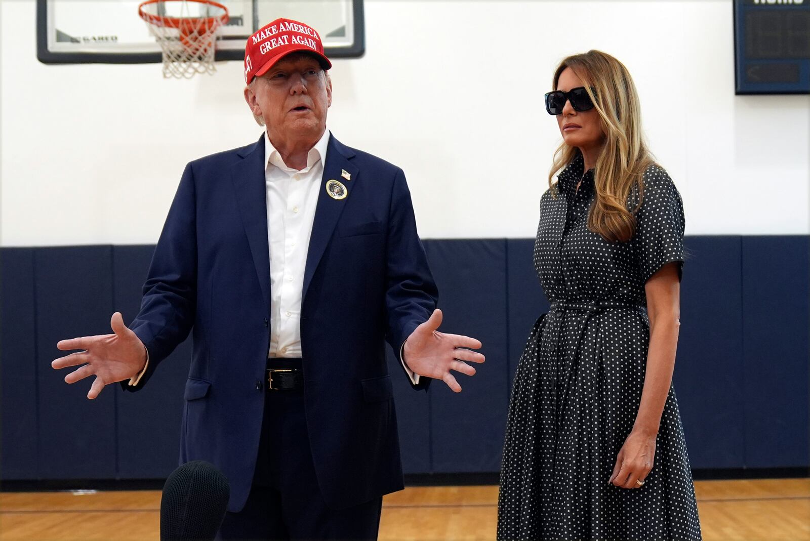 Republican presidential nominee former President Donald Trump speaks as former first lady Melania Trump listens after they voted on Election Day at the Morton and Barbara Mandel Recreation Center, Tuesday, Nov. 5, 2024, in Palm Beach, Fla. (AP Photo/Evan Vucci)