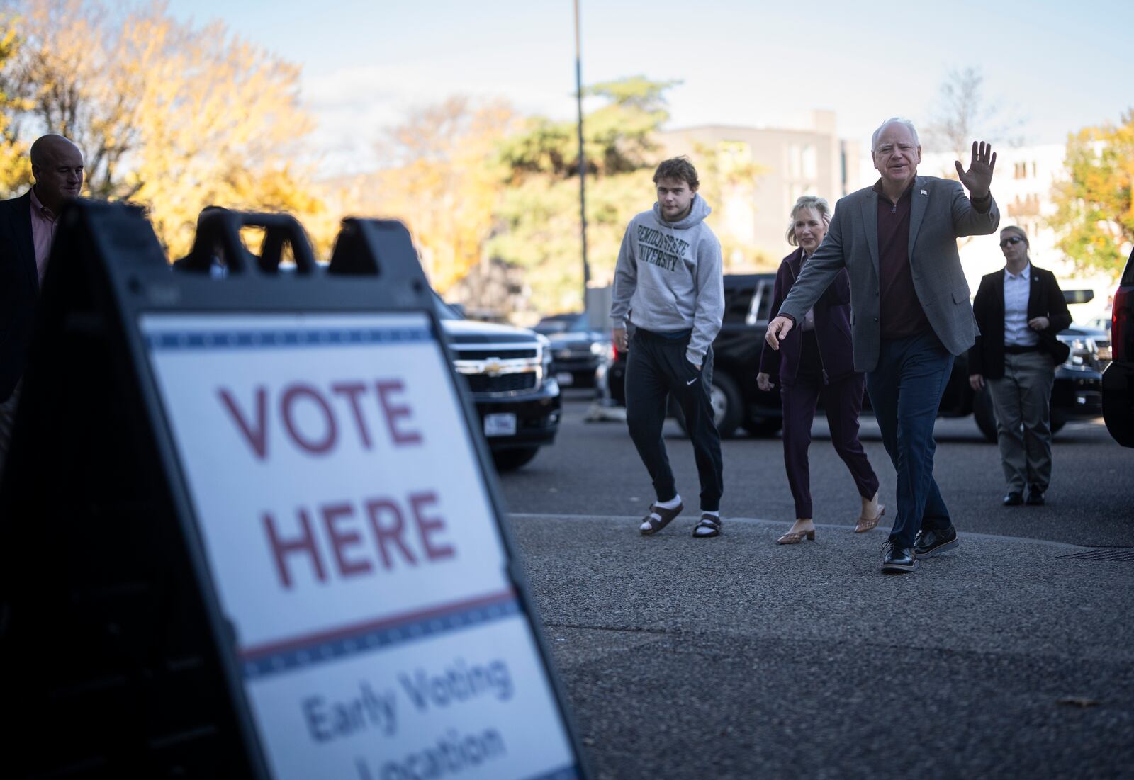 Minnesota Governor and Vice Presidential candidate Tim Walz enters the Ramsey County Elections office with his wife, Gwen, and son, Gus, to early vote in St. Paul, Minn., on Wednesday, October 23, 2024. (Renée Jones Schneider/Star Tribune via AP)