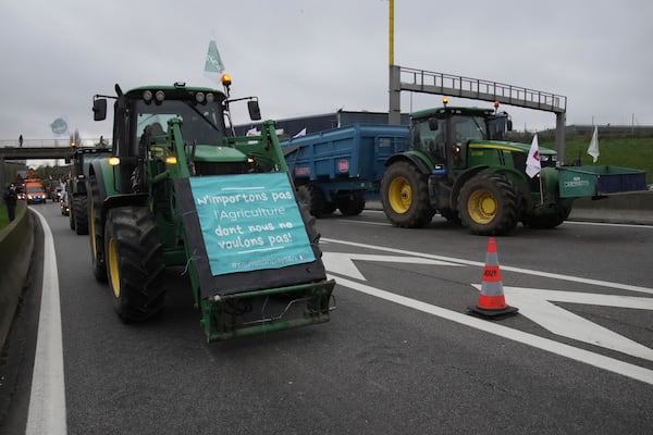 Farmers block a speedway to protest the EU-Mercosur trade agreement, Monday, Nov. 18, 2024 in Velizy-Villacoublay outside Paris. (AP Photo/Christophe Ena)