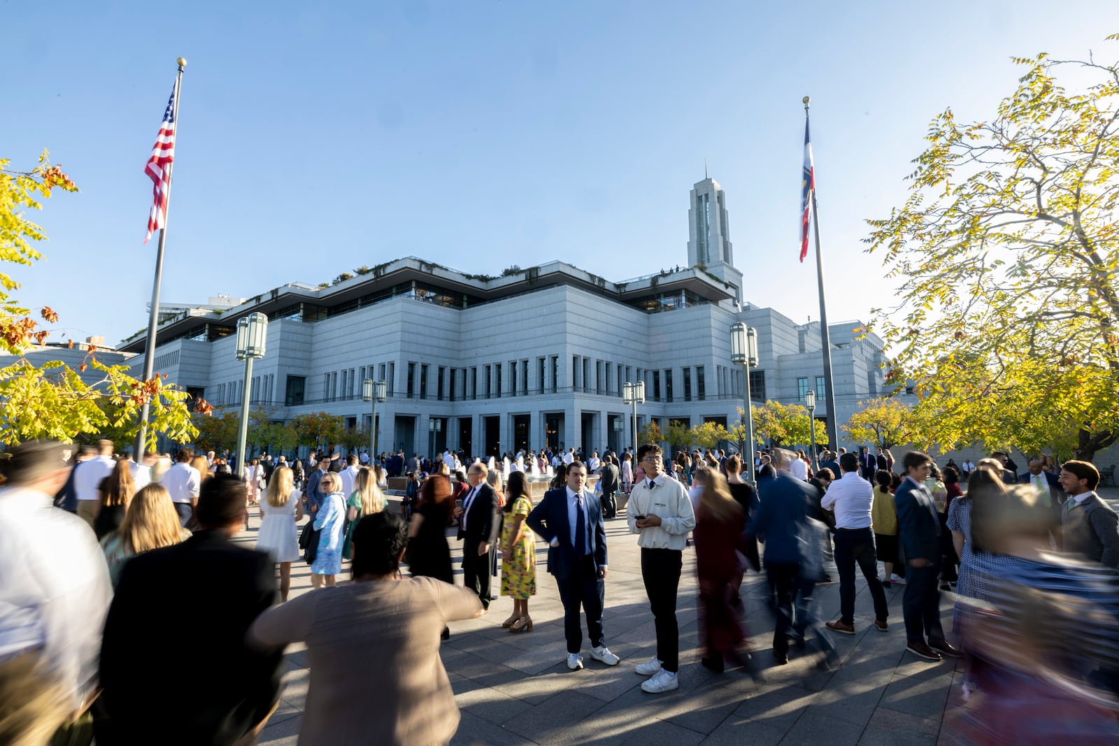 Conferencegoers make their way toward the Conference Center before the morning session of the 194th Semiannual General Conference of The Church of Jesus Christ of Latter-day Saints in Salt Lake City on Saturday, Oct. 5, 2024. (Isaac Hale/The Deseret News via AP)