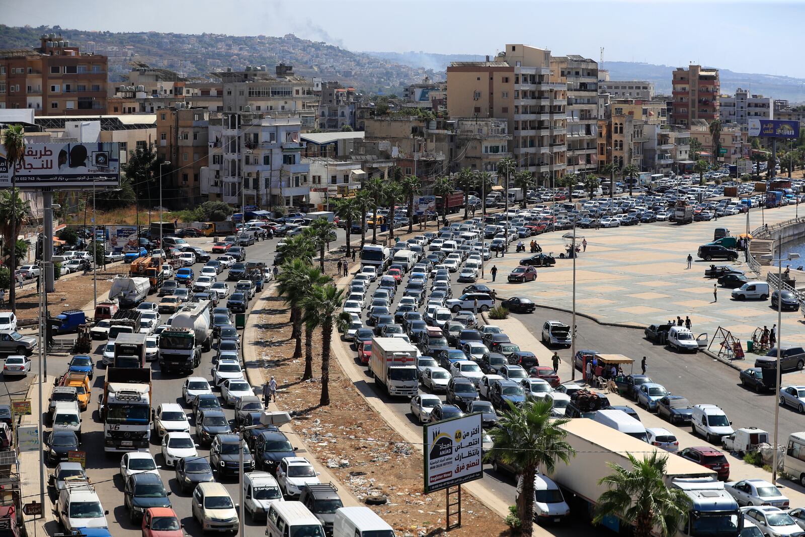 Cars sit in traffic as they flee the southern villages amid ongoing Israeli airstrikes, in Sidon, Lebanon, Monday, Sept. 23, 2024. (AP Photo/Mohammed Zaatari)