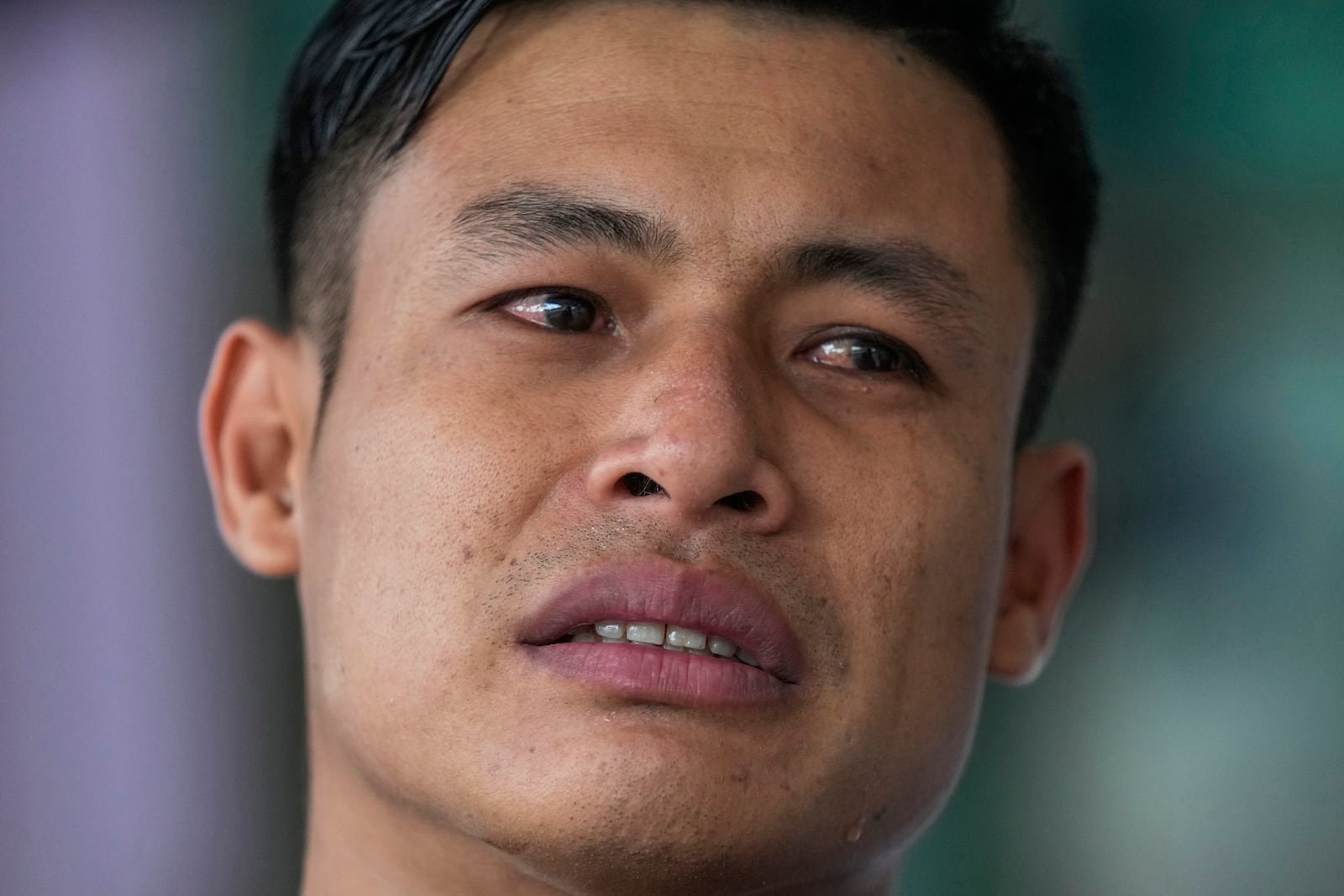 Wichan Seubsaichan, father of one of the victims of the school bus fire cries during an interview with the Associated Press at Wat Khao Phraya Sangkharam School, Lan Sak, Uthai Thani province, Thailand, Thursday, Oct. 3, 2024. (AP Photo/Sakchai Lalit)