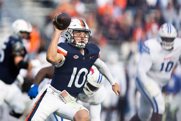 Virginia quarterback Anthony Colandrea (10) looks to make a pass against SMU during the second half of an NCAA college football game, Saturday, Nov. 23, 2024, in Charlottesville, Va. (AP Photo/Mike Kropf)