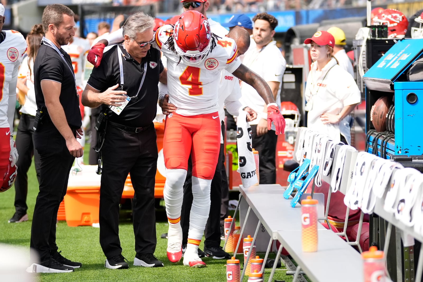 Kansas City Chiefs wide receiver Rashee Rice (4) is assisted after being injured during the first half of an NFL football game against the Los Angeles Chargers Sunday, Sept. 29, 2024, in Inglewood, Calif. (AP Photo/Ashley Landis)