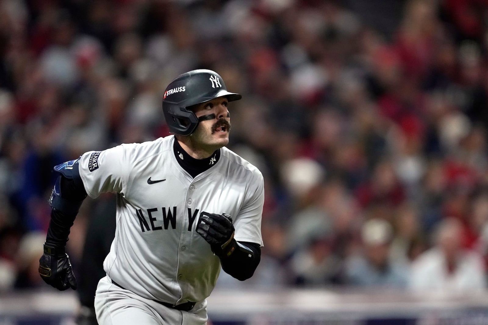 New York Yankees' Austin Wells watches his home run against the Cleveland Guardians during the second inning in Game 4 of the baseball AL Championship Series Friday, Oct. 18, 2024, in Cleveland. (AP Photo/Godofredo A. Vásquez)