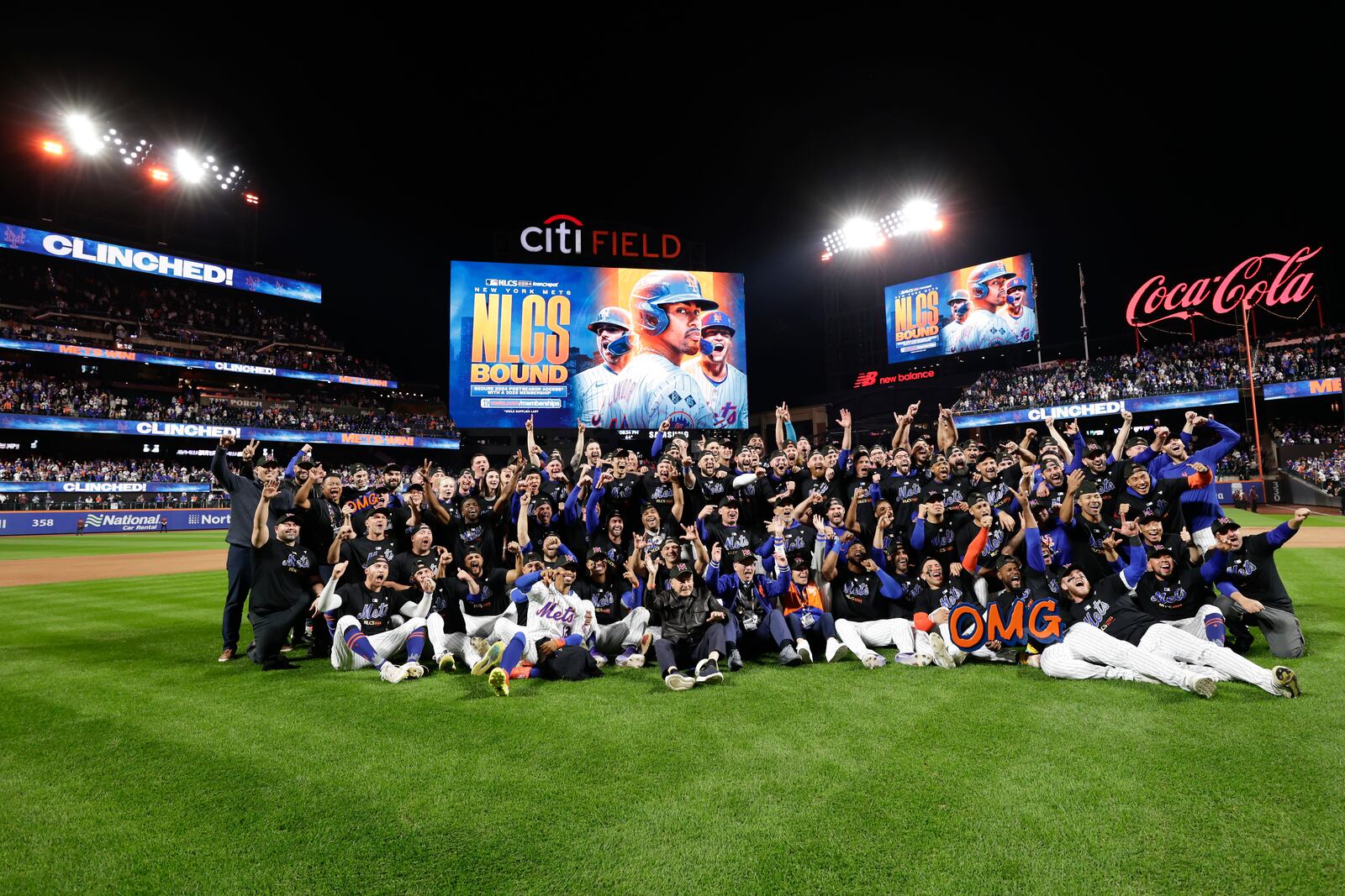 The New York Mets pose for a group photo on the field after defeating the Philadelphia Phillies in Game 4 of the National League baseball playoff series, Wednesday, Oct. 9, 2024, in New York. (AP Photo/Adam Hunger)