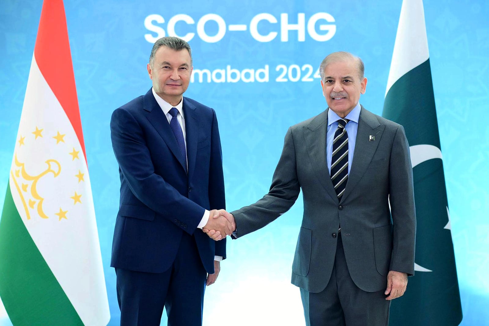 In this photo released by the Press Information Department, Tajikistan's Prime Minister Qohir Rasulzoda, left, shakes hand with his Pakistani counterpart Shehbad Sharif prior to an an Asian security group meeting, in Islamabad, Pakistan, Tuesday, Oct. 15, 2024. (Press Information Department via AP)