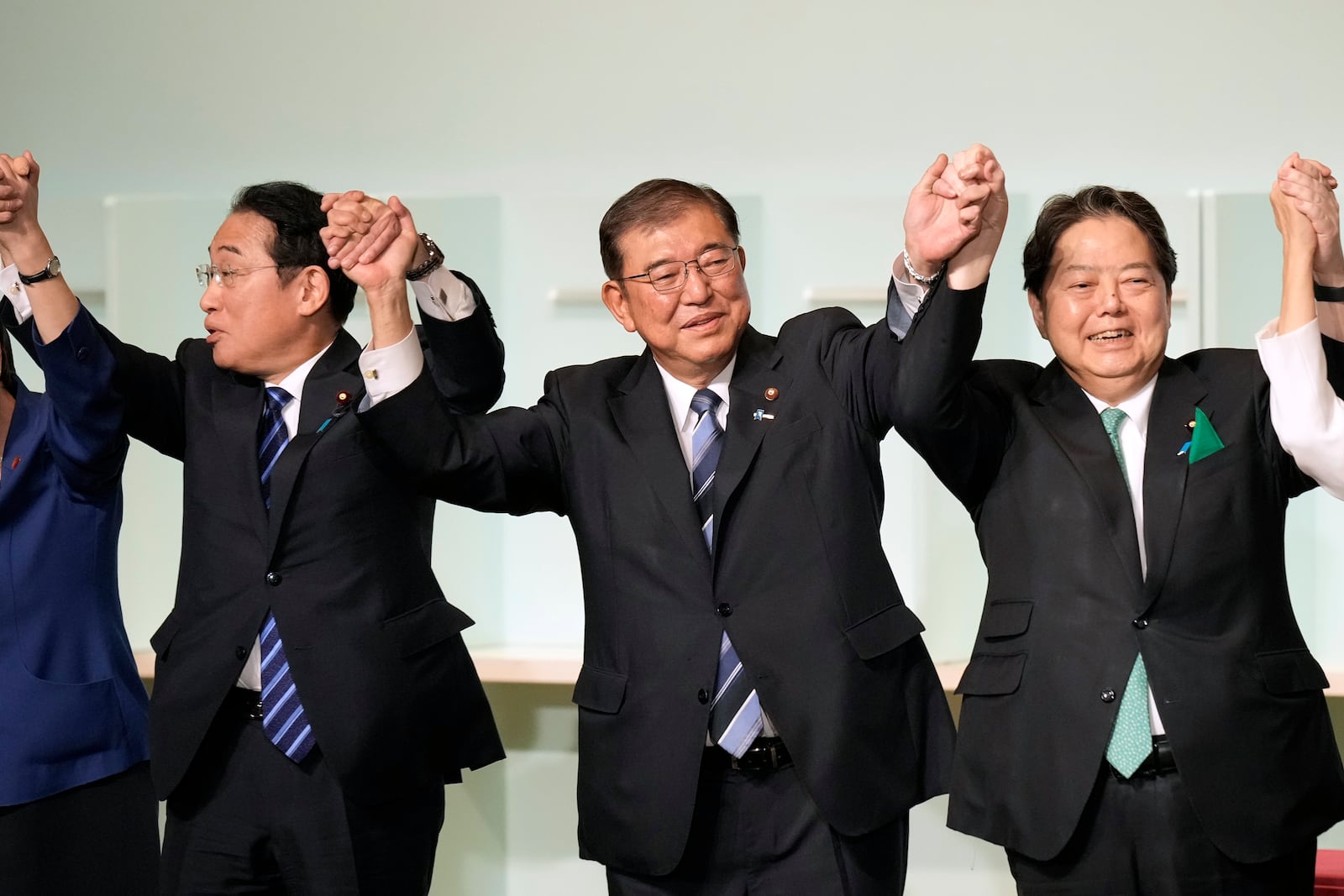 Shigeru Ishiba, center, celebrates after he was elected as new head of Japan's ruling Liberal Democratic Party (LDP) during the party's leadership election Friday, Sept. 27, 2024, in Tokyo. (AP Photo/Hiro Komae, Pool)