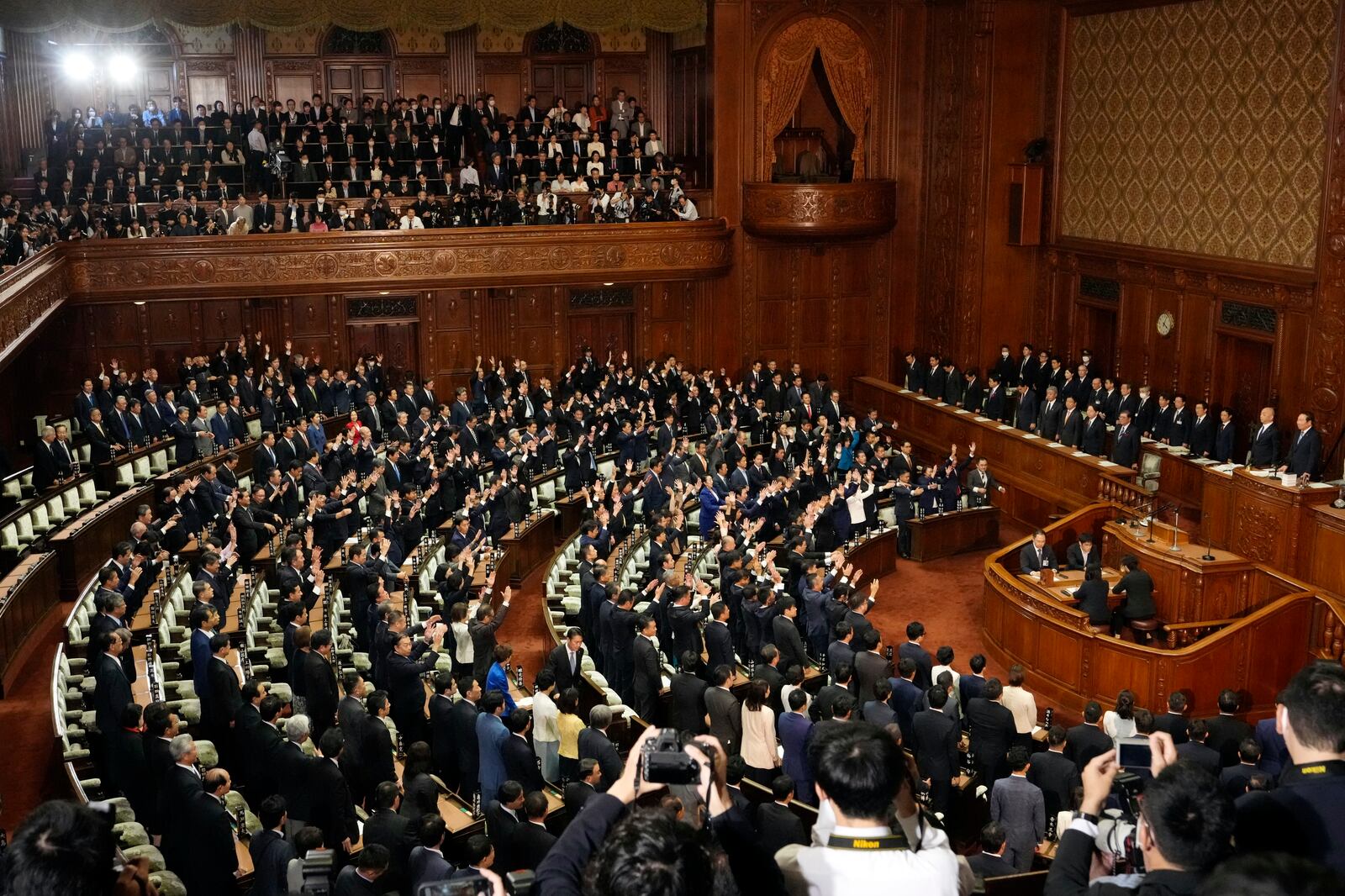 Lawmakers give three cheers after dissolving the lower house, the more powerful of the two parliamentary chambers, during an extraordinary Diet session at the lower house of parliament Wednesday, Oct. 9, 2024, in Tokyo. (AP Photo/Hiro Komae)