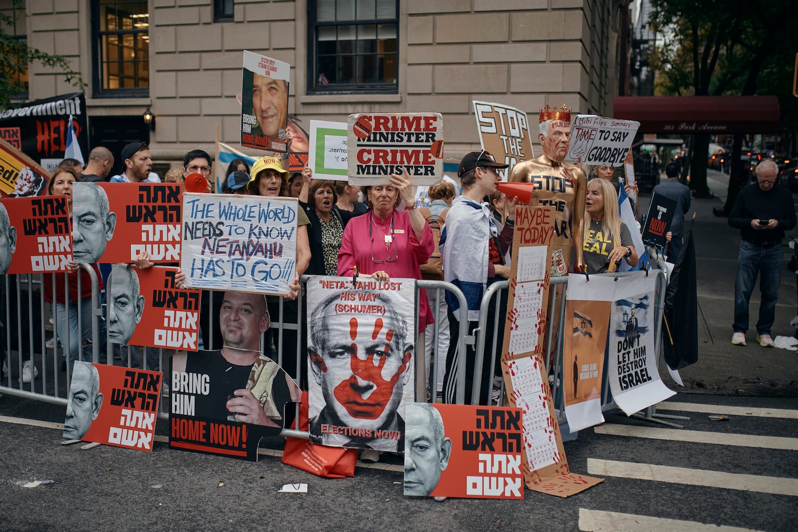 People protest against Prime Minister of Israel Benjamin Netanyahu during the 79th session of the United Nations General Assembly, in New York, on Friday, Sept. 27, 2024. (AP Photo/Andres Kudacki)