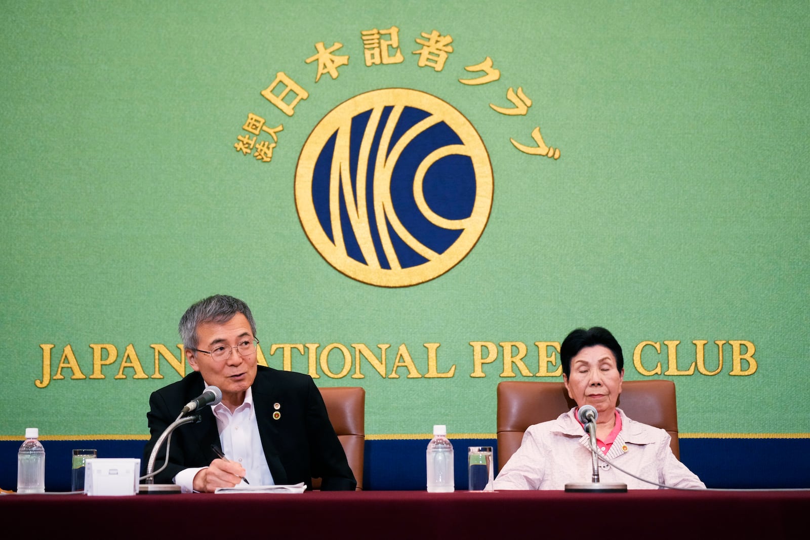 Hideyo Ogawa, left, lawyer for Iwao Hakamada, who was recently acquitted by a district court after a retrial for a 1966 quadruple murder, speaks during a news conference in Tokyo, Monday, Sept. 30, 2024. Iwao Hakamada's sister Hideko Hakamada sits next to the lawyer. (AP Photo/Hiro Komae)