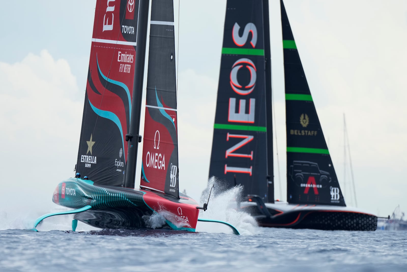 Ineos Britannia and Emirates Team New Zealand race during Louis Vuitton 37th America's Cup Day 5 race 7 in Barcelona, Spain, Friday, Oct. 18, 2024. (AP Photo/Bernat Armangue)