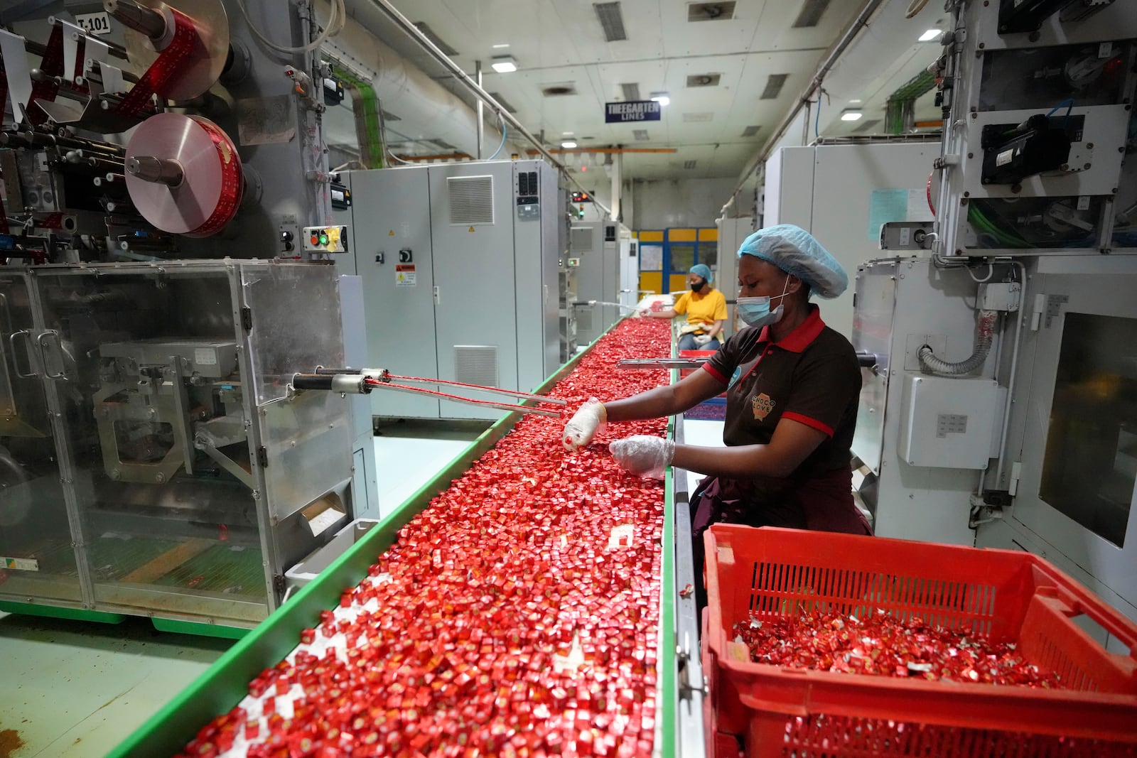 Workers package bouillon cubes at the Sweet Nutrition factory in Ota, Nigeria, Thursday, Sept. 12, 2024. (AP Photo/Sunday Alamba)