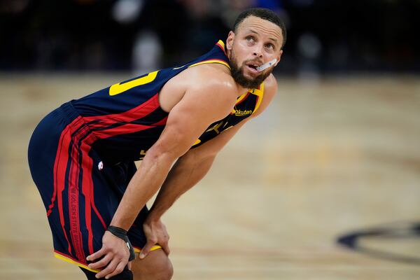 Golden State Warriors guard Stephen Curry looks at the scoreboard during the second half of Game 4 of an NBA basketball first-round playoff series against the Houston Rockets, Monday, April 28, 2025, in San Francisco. (AP Photo/Godofredo A. Vásquez)