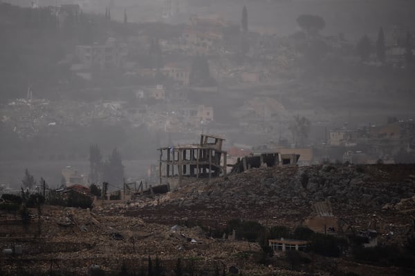 Destroyed buildings stand on an area of a village in southern Lebanon as seen from northern Israel, Monday, Nov. 25, 2024. (AP Photo/Leo Correa)