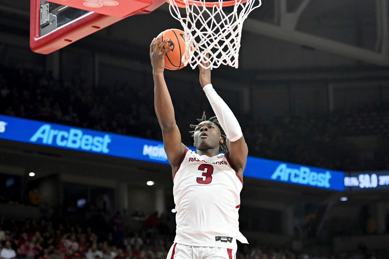 Arkansas forward Adou Thiero (3) scores on a fast break against Lipscomb during the second half of an NCAA college basketball game Wednesday, Nov. 6, 2024, in Fayetteville, Ark. (AP Photo/Michael Woods)