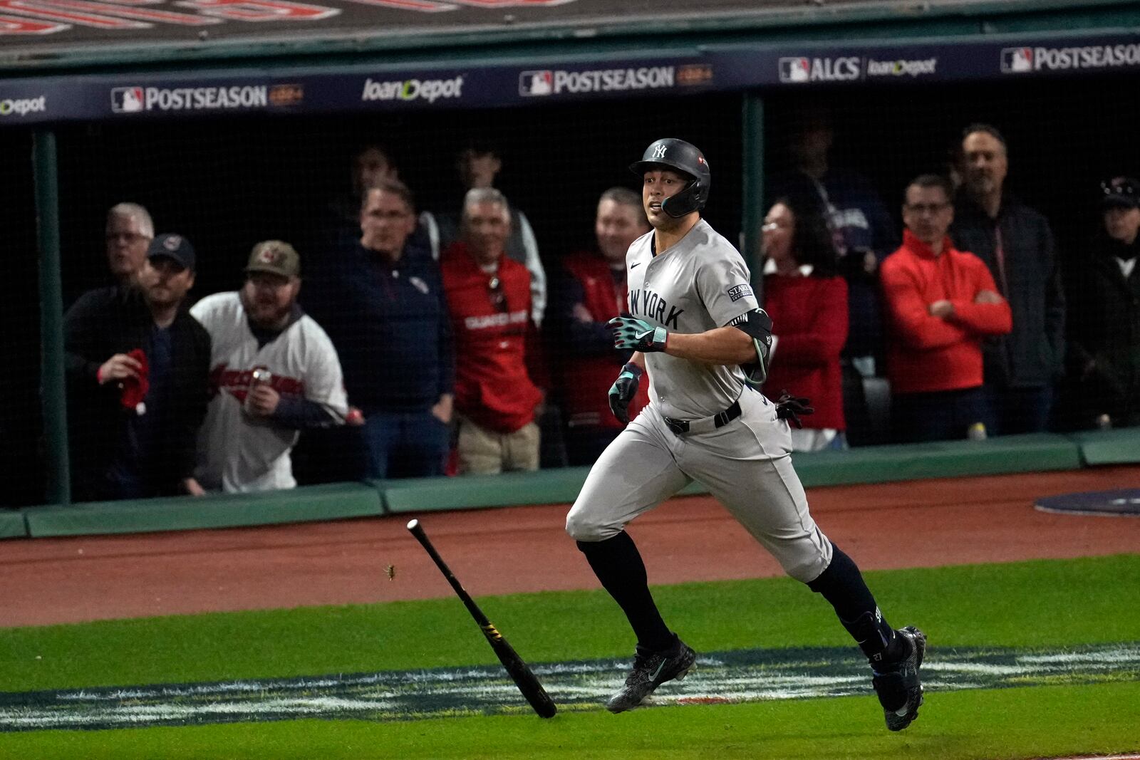 New York Yankees' Giancarlo Stanton watches his home run against the Cleveland Guardians during the eighth inning in Game 3 of the baseball AL Championship Series Thursday, Oct. 17, 2024, in Cleveland.(AP Photo/Sue Ogrocki)