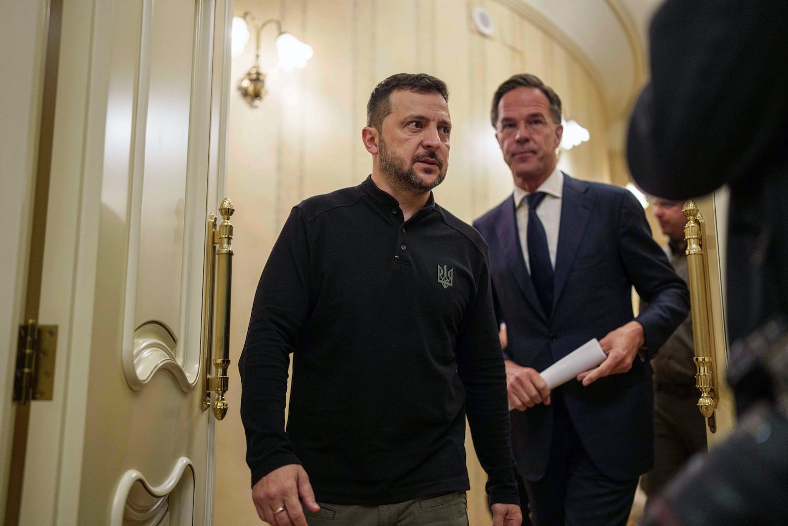 NATO Secretary General Mark Rutte, right, and Ukrainian President Volodymyr Zelenskyy walk in a corridor before a press conference in Kyiv, Ukraine, Thursday Oct. 3, 2024. (AP Photo/Evgeniy Maloletka)