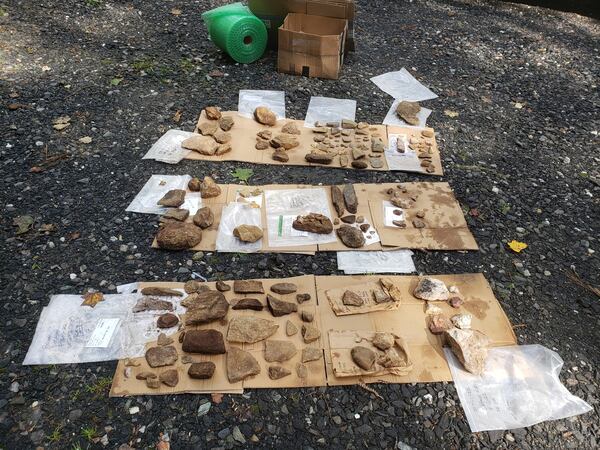 This Aug. 18, 2022, photo provided by Scott Ashcraft shows cultural artifacts that were cleaned after being uncovered from sloped terrain during survey work in the Pisgah National Forest near Celo, North Carolina. (Scott Ashcraft via AP)