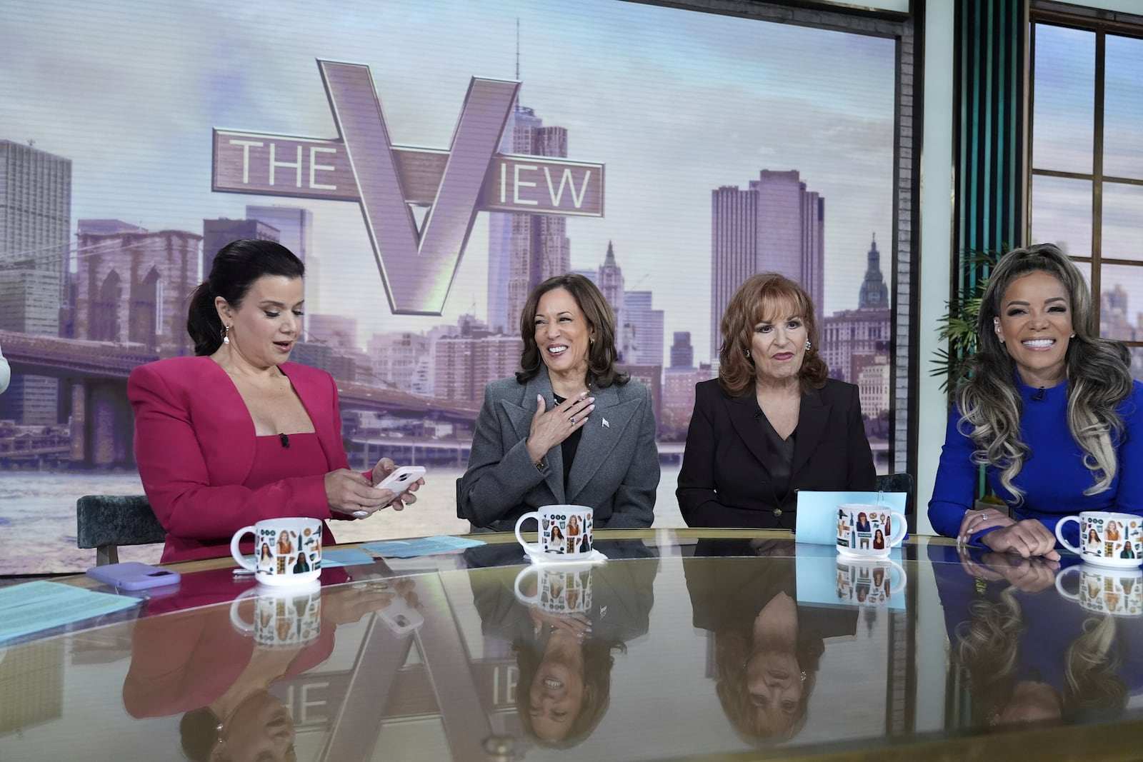 Democratic presidential nominee Vice President Kamala Harris chats with the hosts during a commercial break at The View, Tuesday, Oct. 8, 2024, in New York. (AP Photo/Jacquelyn Martin)