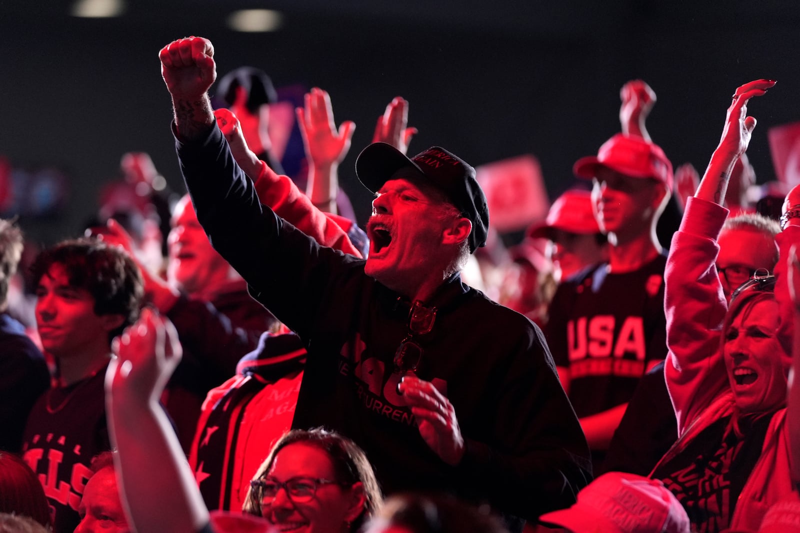 Attendees cheer as Republican presidential nominee former President Donald Trump speaks during a campaign rally at the Suburban Collection Showplace, Saturday, Oct. 26, 2024, in Novi, Mich. (AP Photo/Alex Brandon)