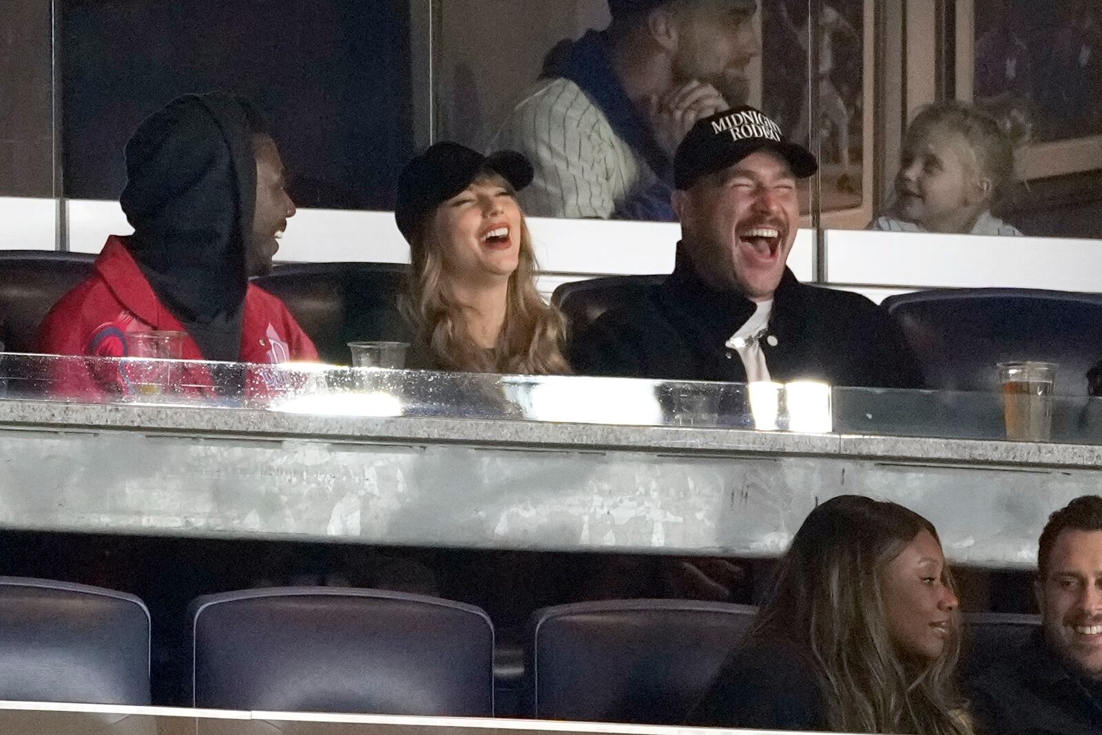 Travis Kelce, right, and Taylor Swift attend Game 1 of the baseball AL Championship Series between the Cleveland Guardians and New York Yankees Monday, Oct. 14, 2024, in New York. (AP Photo/Seth Wenig)