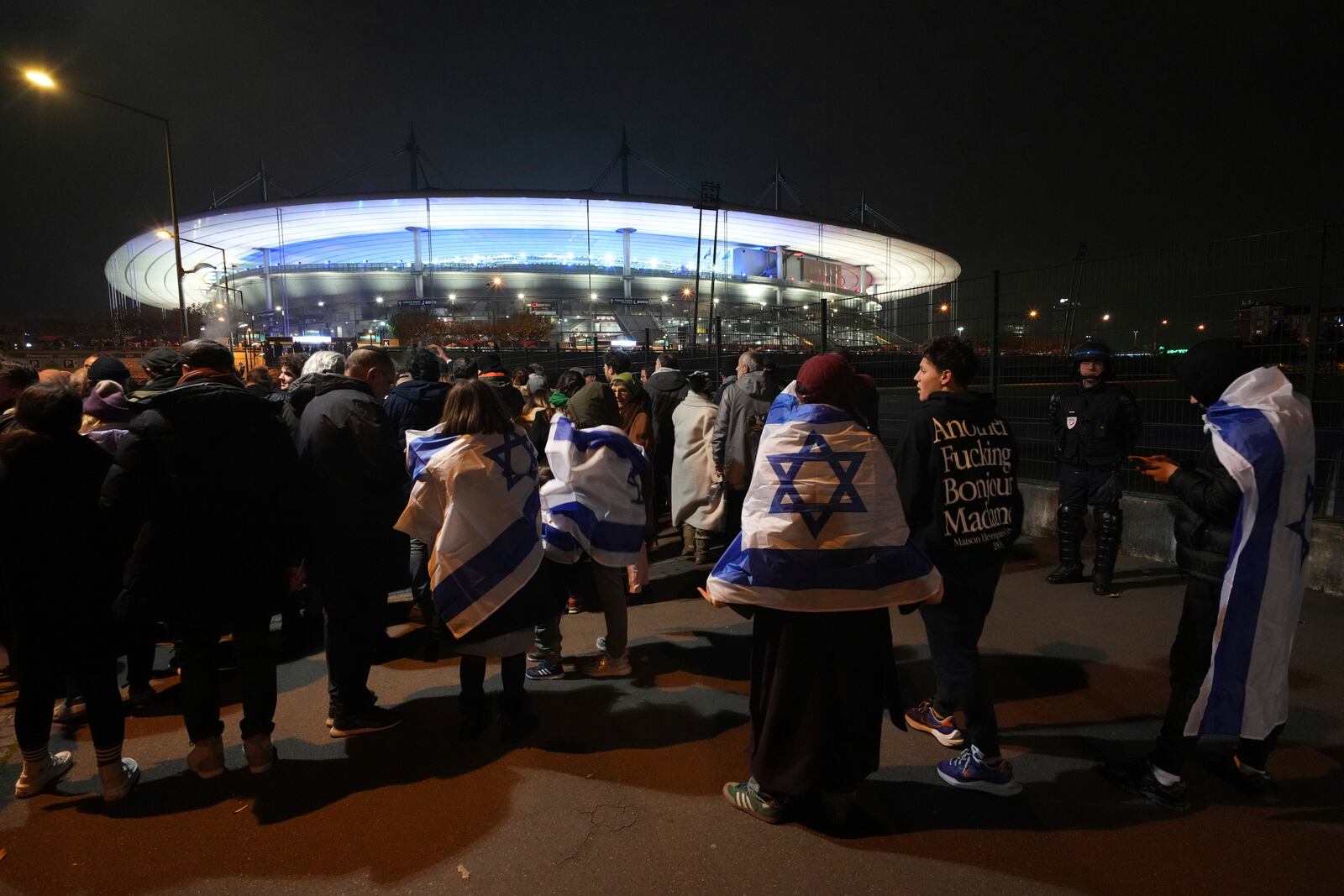 Israeli supporters arrive at the Stade de France stadium ahead of the Nations League soccer match France against Israel , Thursday, Nov. 14, 2024 in Saint-Denis, outside Paris. (AP Photo/Aurelien Morissard)