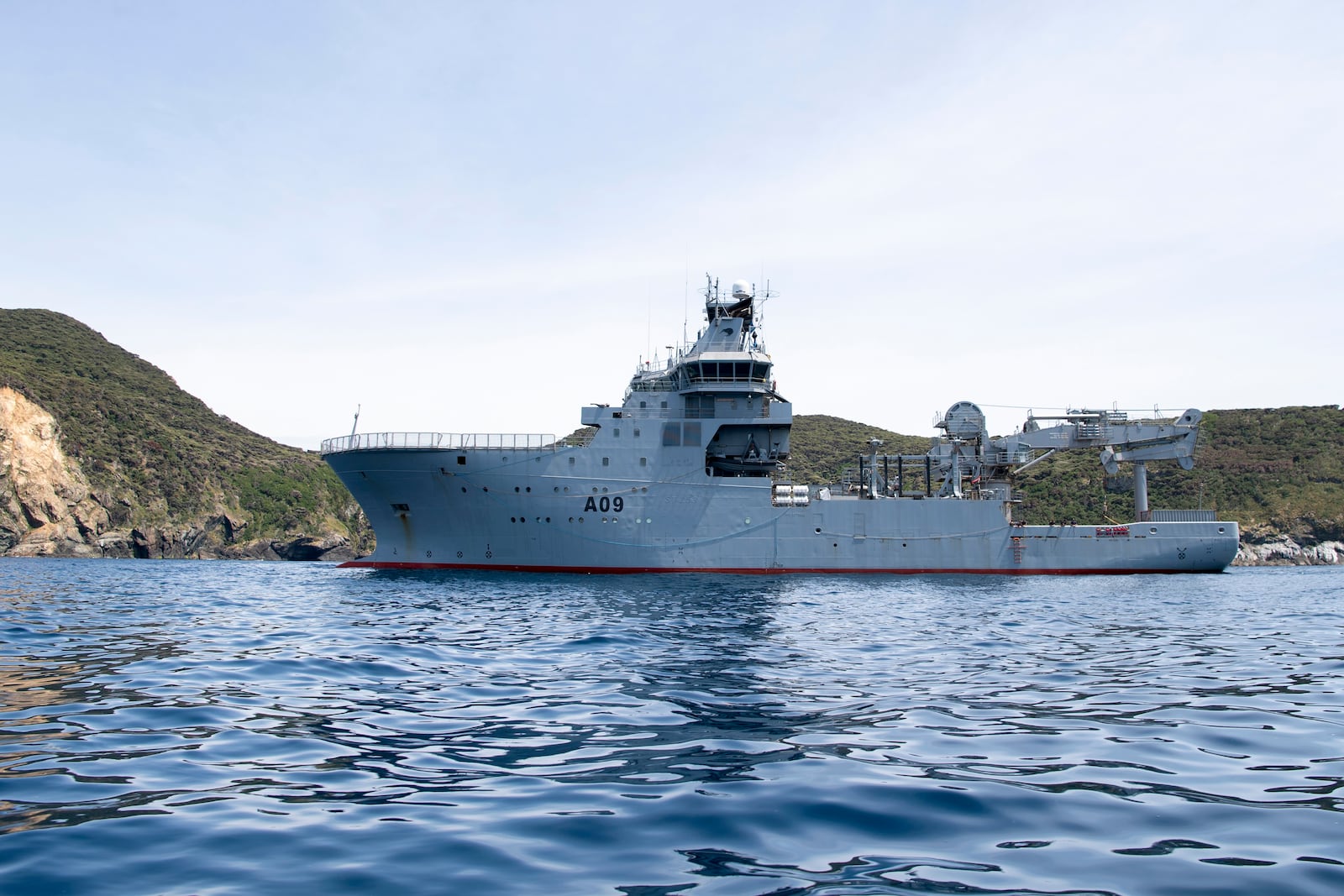 This image released by New Zealand Defence Force (NZDF), shows HMNZS Manawanui at the Three Kings islands off the coast New Zealand, on Dec. 1, 2023. (Petty Officer Chris Weissenborn/NZDF via AP)