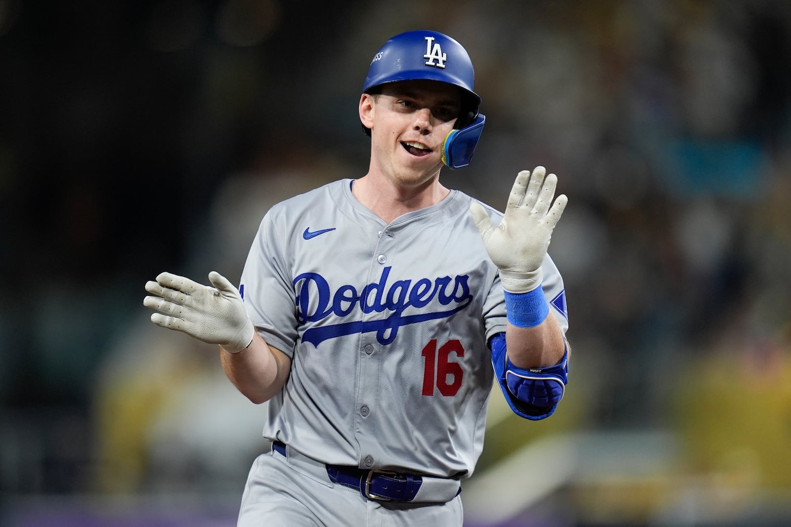 Los Angeles Dodgers' Will Smith celebrates after connecting for a two-run home run during the third inning in Game 4 of a baseball NL Division Series against the San Diego Padres, Wednesday, Oct. 9, 2024, in San Diego. (AP Photo/Gregory Bull)