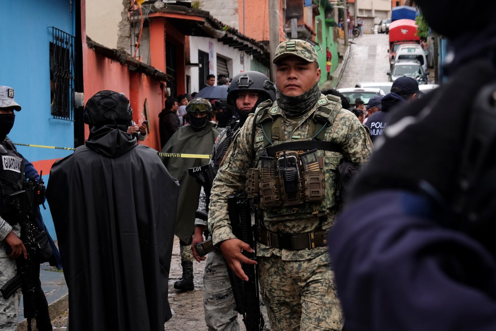 Soldiers, National Guards and police cordon off the site where Catholic priest Marcelo Perez died in an armed attack after attending mass at a church in San Cristobal de las Casas, Chiapas state, Mexico, Sunday, Oct. 20, 2024. (AP Photo/Isabel Mateos)