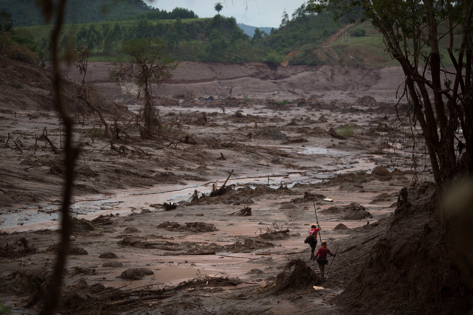 FILE - Rescue workers search for victims in Bento Rodrigues, Brazil, two days after a tsunami of mud, caused by a dam break, engulfed the town in the state of Minas Gerais, Nov. 8, 2015. (AP Photo/Felipe Dana, File)