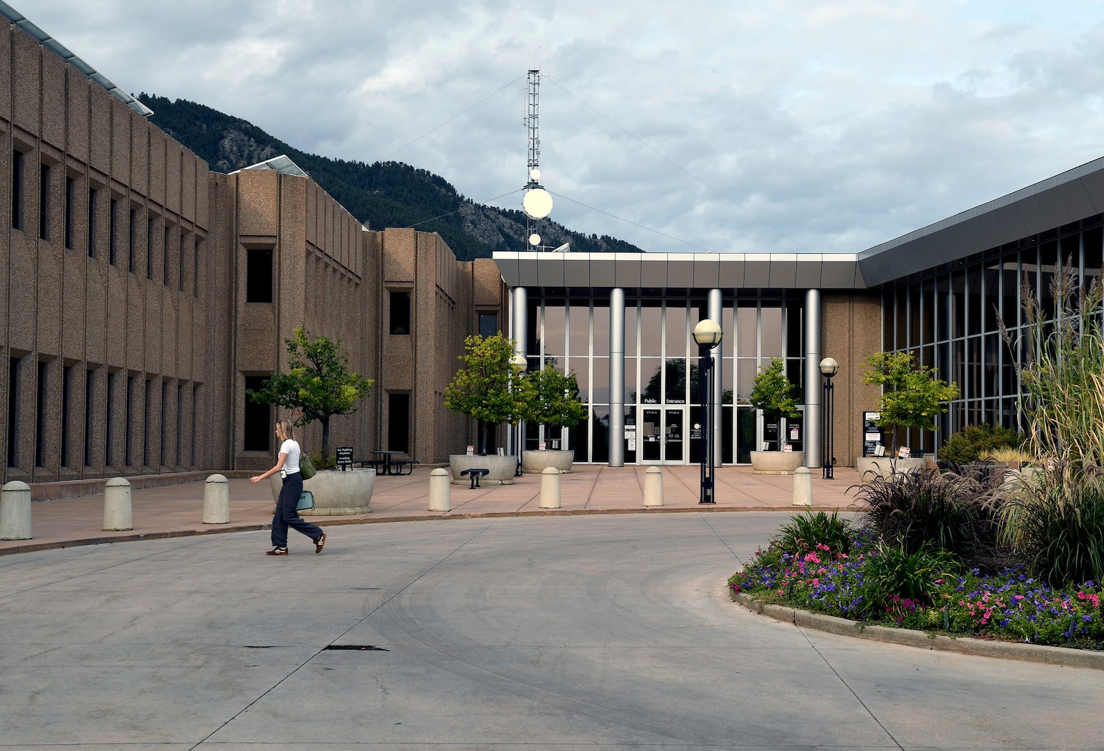 A woman walks in front of the Boulder County Justice Center in Boulder, Colo., on Thursday, Sept. 5, 2024. (AP Photo/Thomas Peipert)