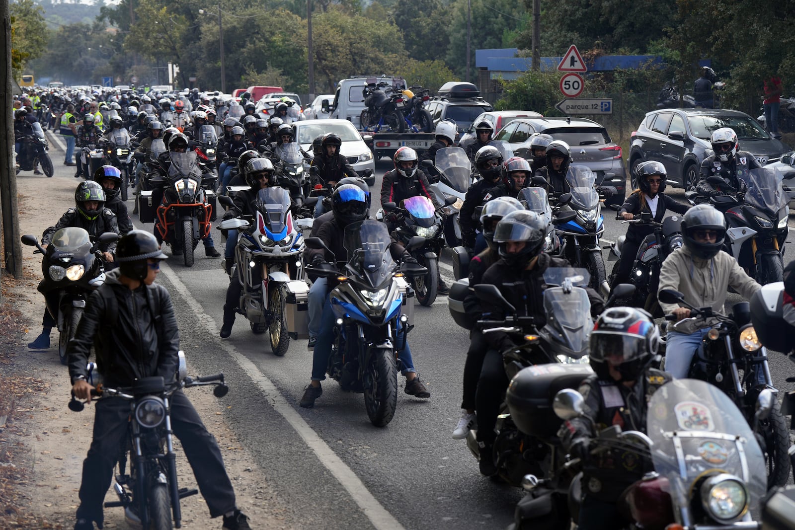 Thousands of motorcyclists leave after attending the IX Pilgrimage of the Blessing of Helmets at the Roman Catholic holy shrine of Fatima, in Fatima, Portugal, Sunday, Sept. 22, 2024. (AP Photo/Ana Brigida)