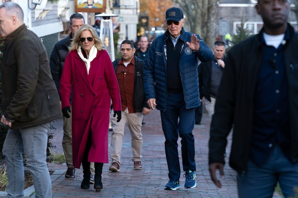 President Joe Biden, right, and first lady Jill Biden walk in downtown Nantucket, Mass., Friday, Nov. 29, 2024. (AP Photo/Jose Luis Magana)