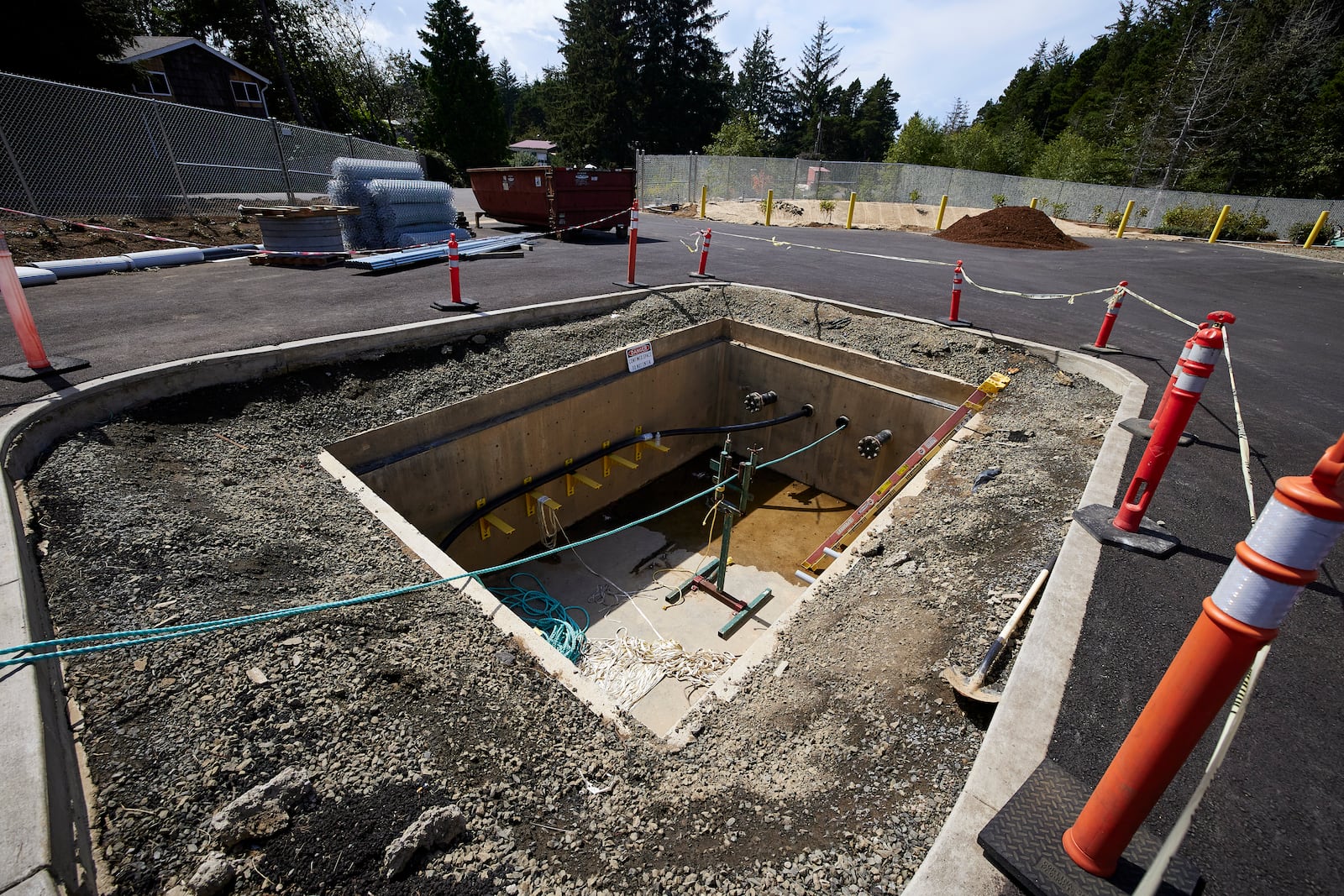 Concrete vaults under the parking lot at Driftwood State Beach where subsea cables connected to the wave energy test site arrive on land and connect to land cables in Newport, Ore., Friday, Aug. 23, 2024. (AP Photo/Craig Mitchelldyer)