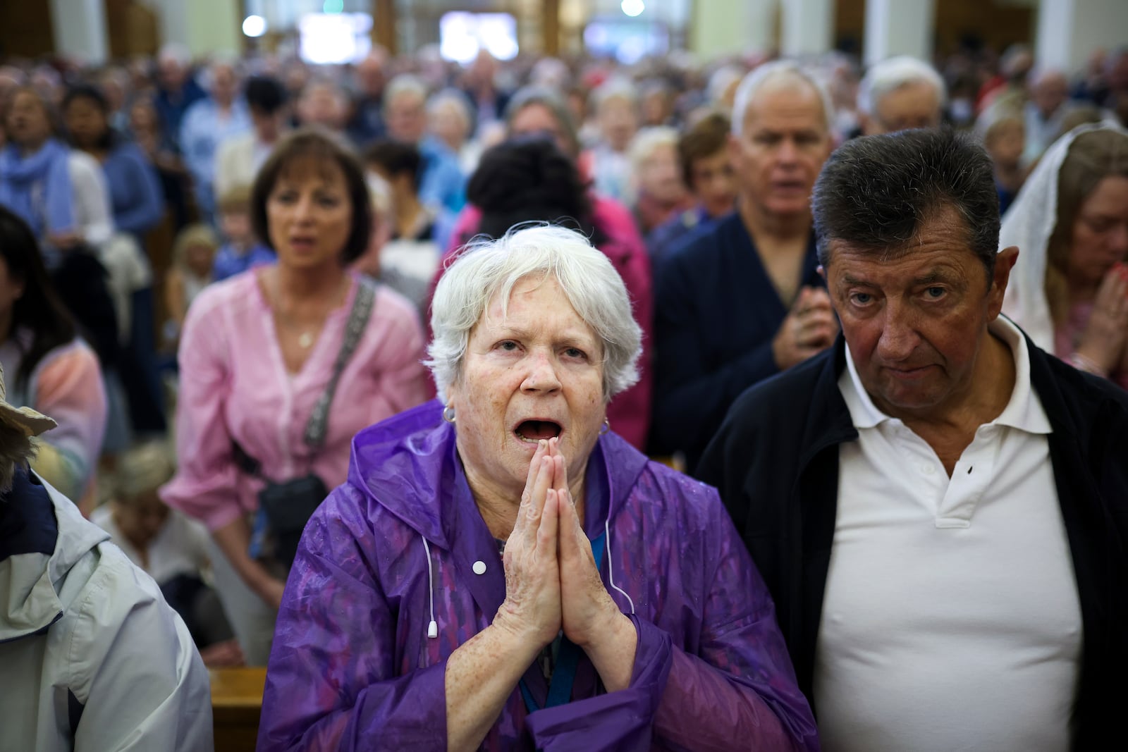 Pilgrims say their prayers inside the St. James Church in Medjugorje, Bosnia, Thursday, Sept. 19, 2024. (AP Photo/Armin Durgut)